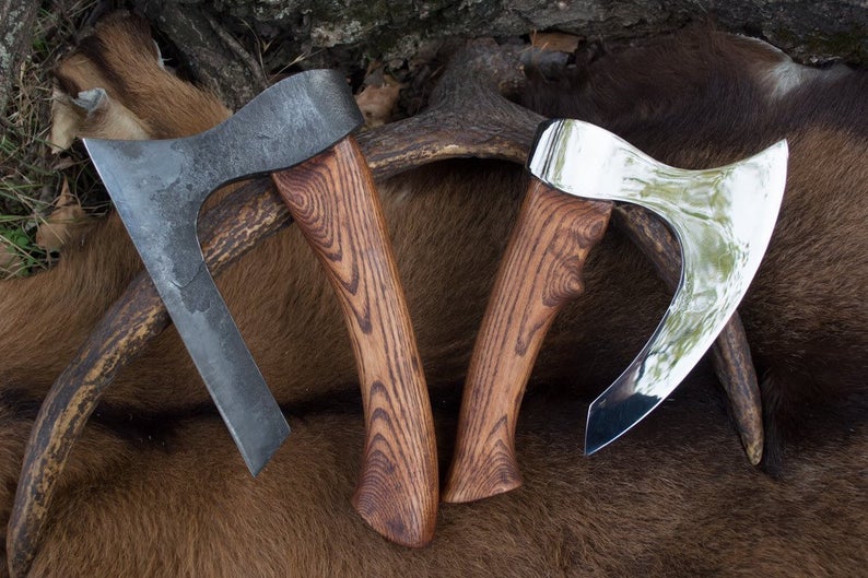 Forged fist axe with a case
